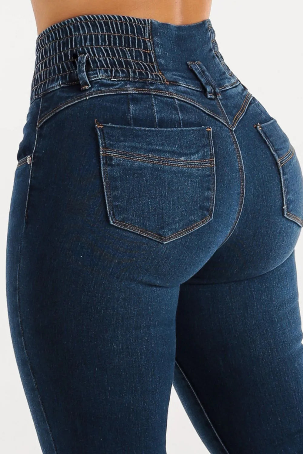Blue jeans with a focus on the back pocket and waistband.