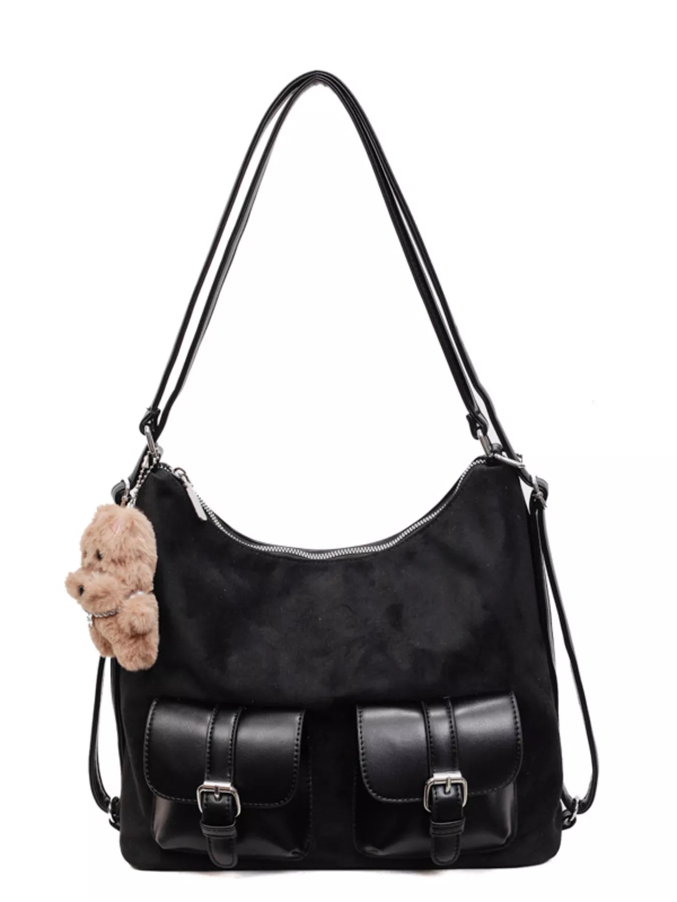 Black handbag with a teddy bear attached to the strap on a white background