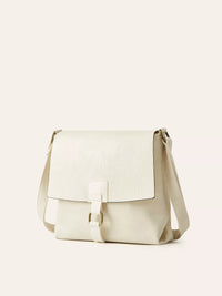Beige shoulder bag on a light beige background