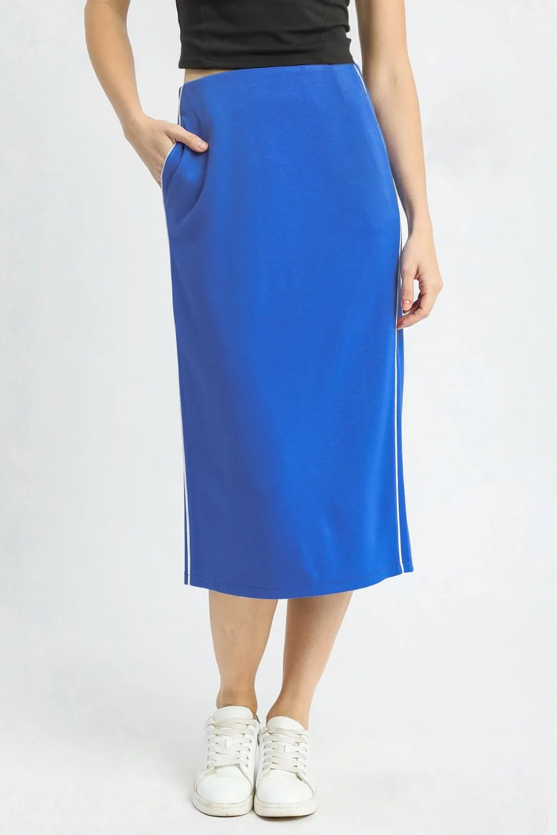 Person wearing a blue skirt on a white background