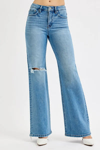 Blue flared jeans on a white background