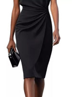 Black dress worn by a model on a white background