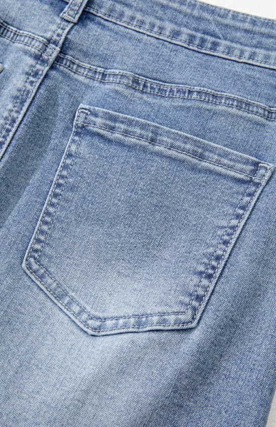 close up view of back pocket on Distressed Raw Hem Heart Denim Skirt