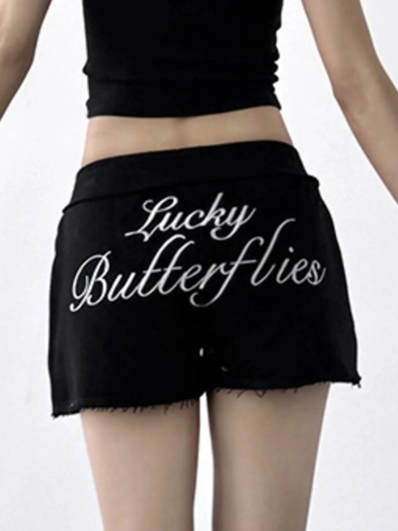 Black skirt with 'Lucky Butterflies' text on a white background