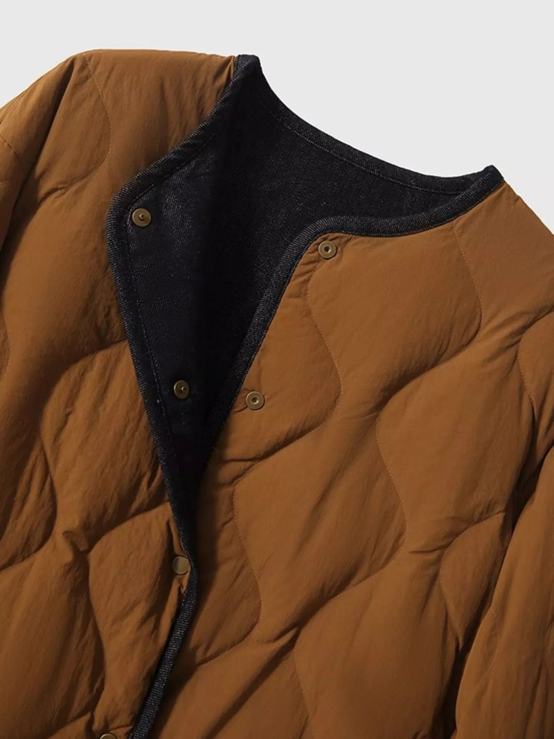 A view of the front snaps on the brown Diamond-Quilted Lightweight Cropped Reversible Down Jacket