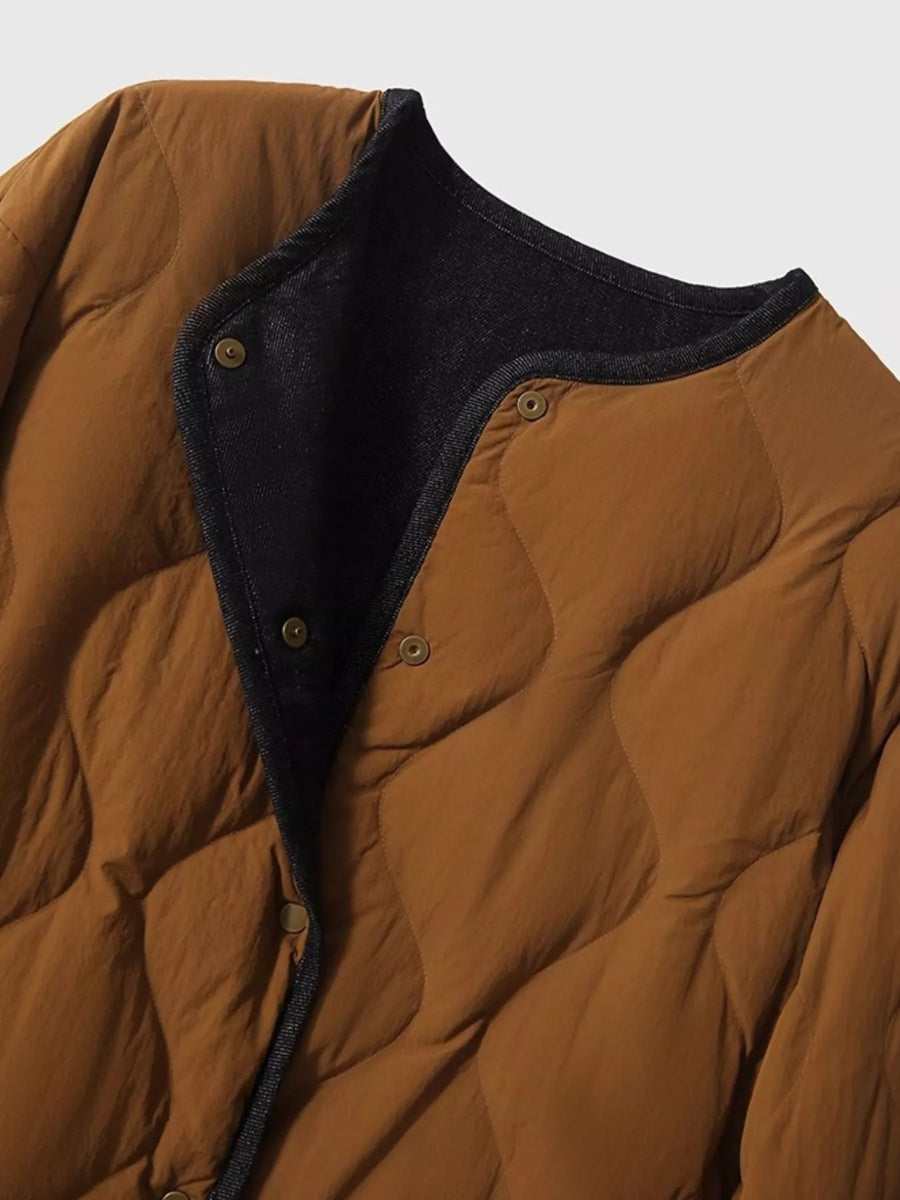 A view of the front snaps on the brown Diamond-Quilted Lightweight Cropped Reversible Down Jacket