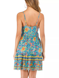 Woman wearing a colorful floral dress on a white background