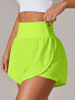 Person wearing a bright green skirt with a plain background