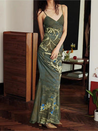 Woman wearing a green floral dress in an indoor setting