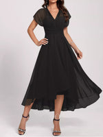 Black dress with sheer sleeves on a white background