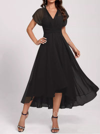 Black dress with sheer sleeves on a white background