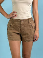 Brown shorts worn by a person on a blue background