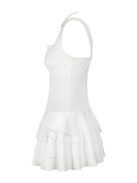 White dress with ruffled skirt on a white background