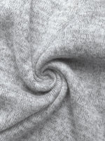 Close-up of gray fabric with a swirl pattern