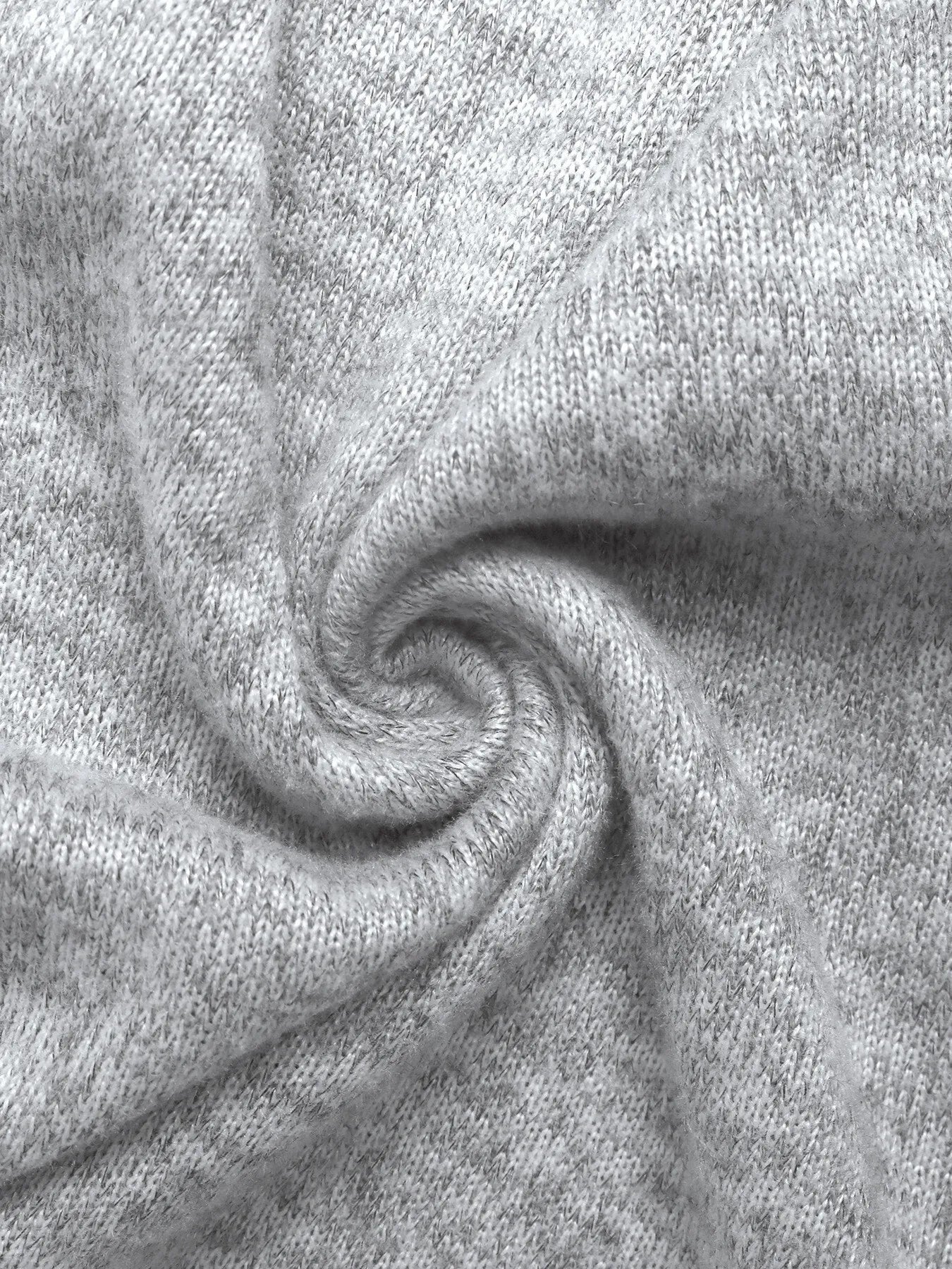 Close-up of gray fabric with a swirl pattern