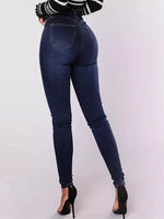 Person wearing blue jeans on a white background