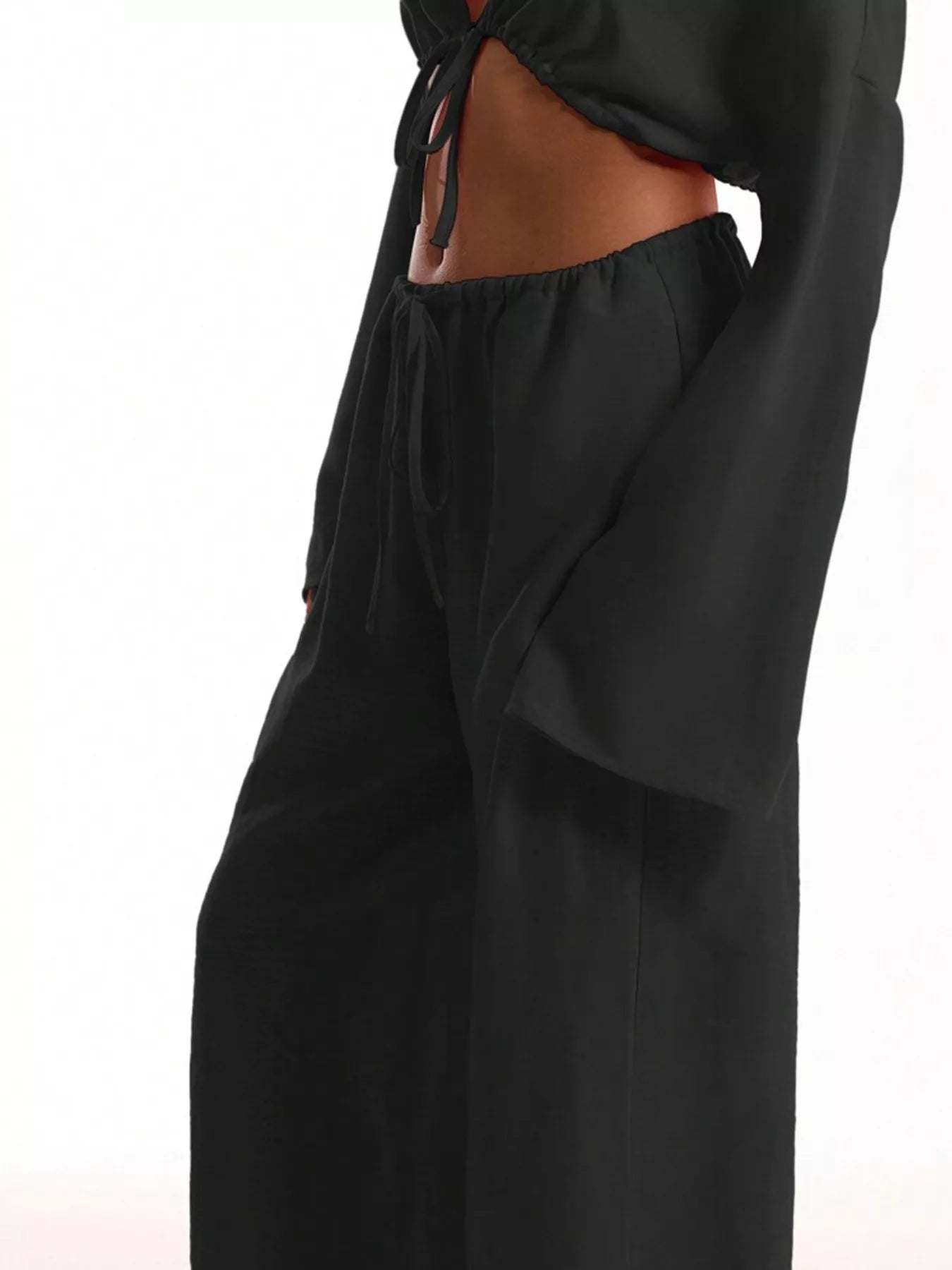 Black wide-leg pants on a white background