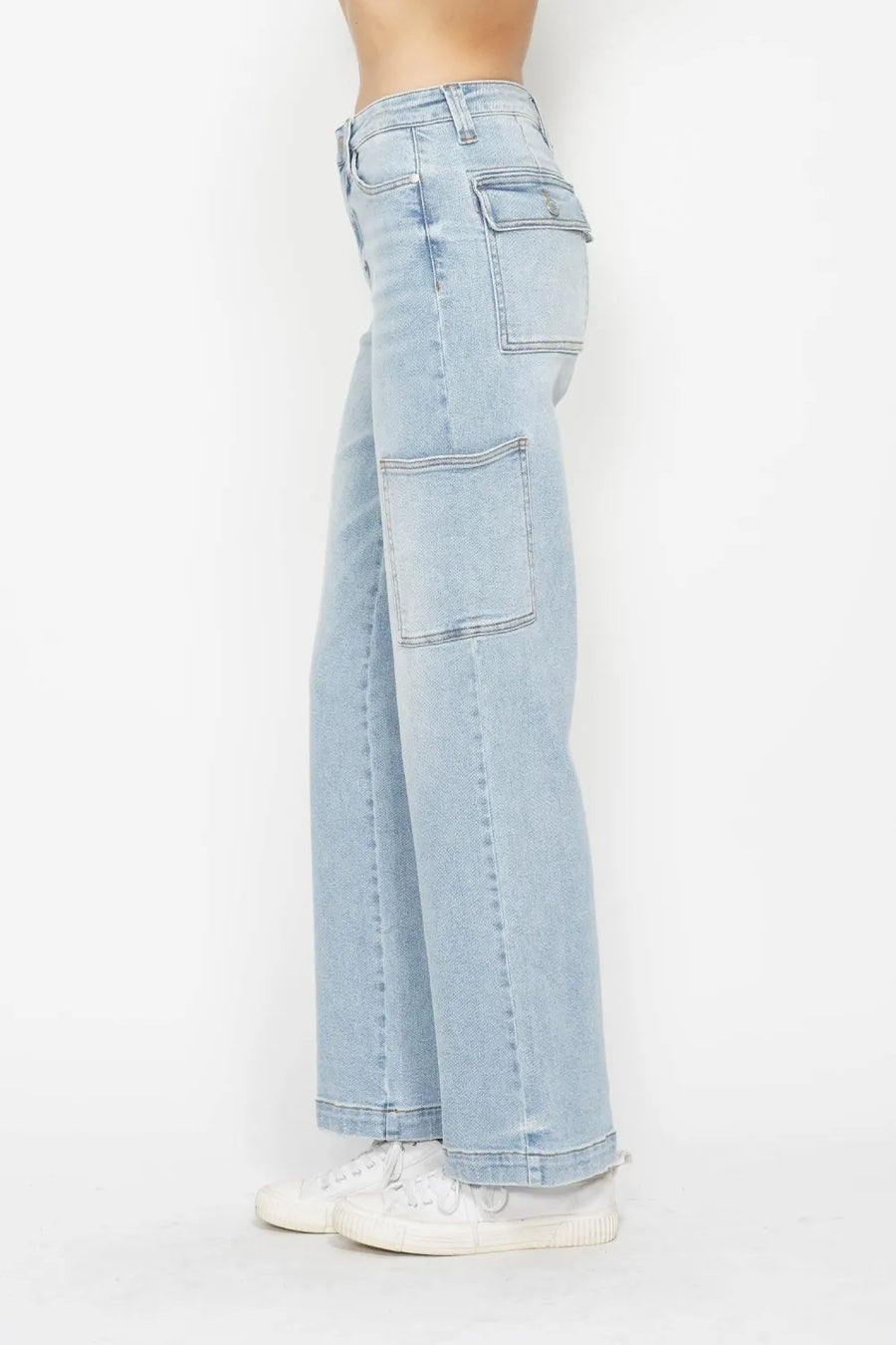Light blue jeans worn by a person on a white background