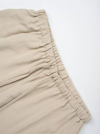Beige pants with a white background