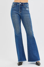 Blue flared jeans on a white background