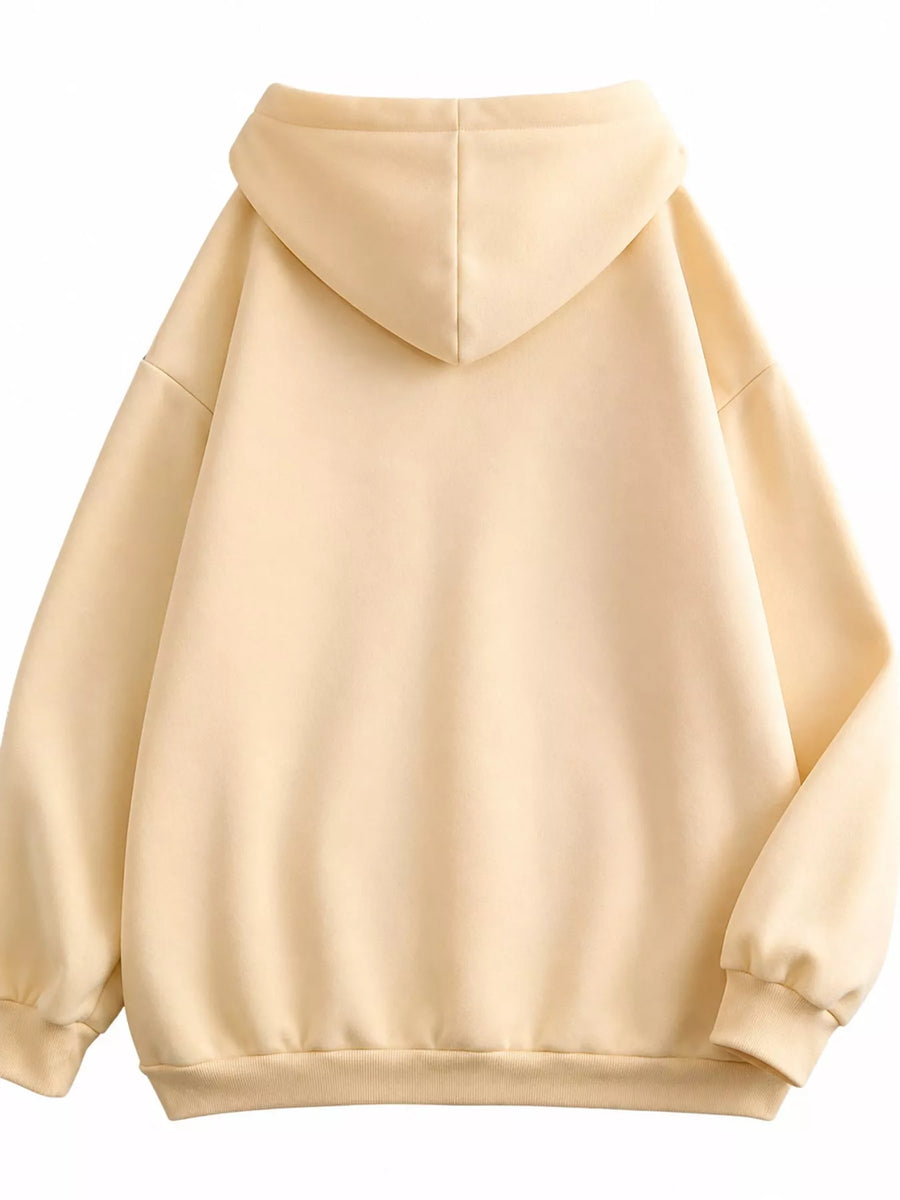 A light beige pullover hoodie shown from the back, featuring a simple center seam, ribbed cuffs, and a ribbed hem against a plain white background.