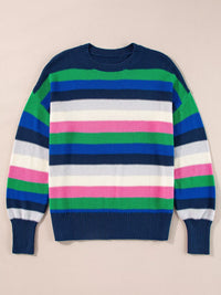 Colorful striped sweater on a beige background