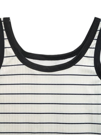 Close-up of a black and white striped dress with a focus on the neckline.