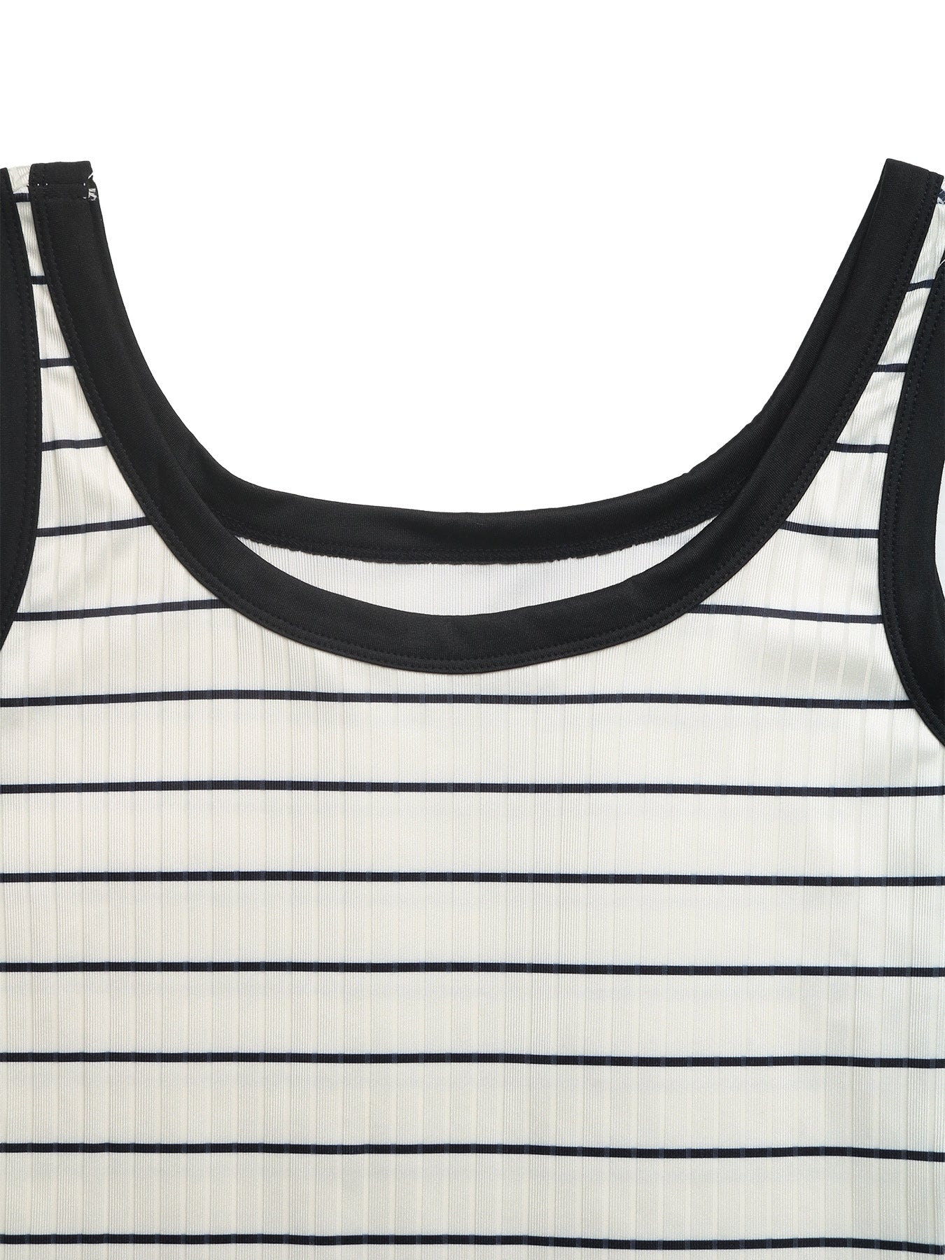 Close-up of a black and white striped dress with a focus on the neckline.