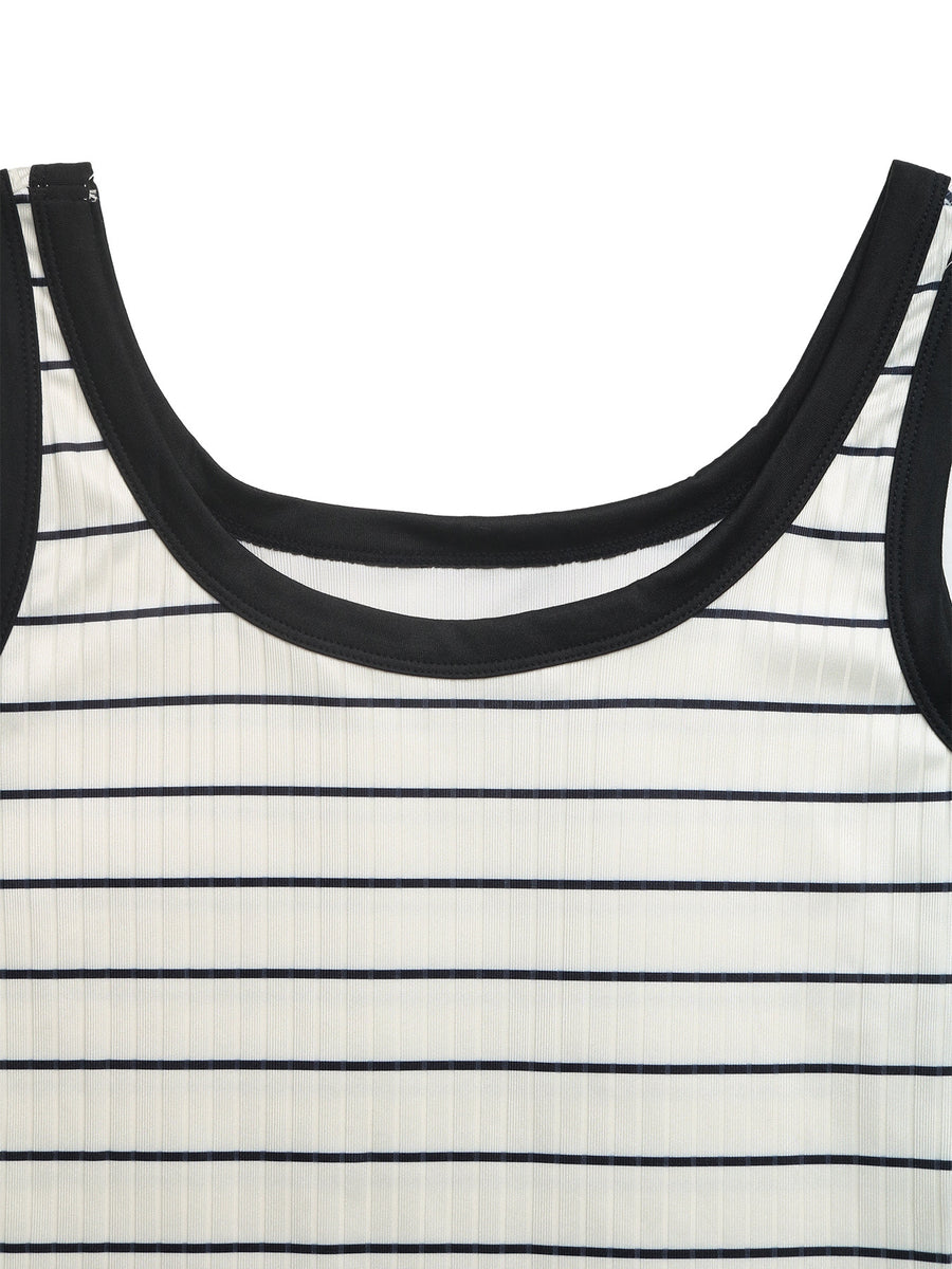 Close-up of a black and white striped dress with a focus on the neckline.