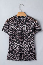 Leopard print dress on a hanger against a light gray background