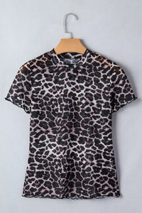 Leopard print dress on a hanger against a light gray background