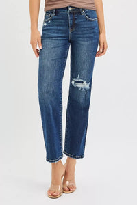 Blue jeans with a distressed design on a white background