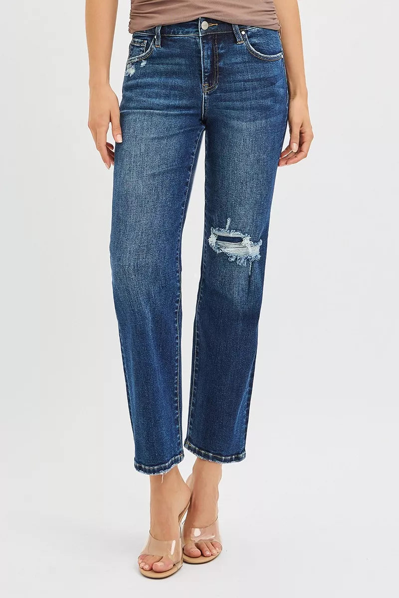 Blue jeans with a distressed design on a white background