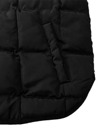 Close-up of a black puffer vest with quilted texture on a white background