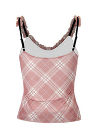Pink plaid tank top with ruffled straps on a white background