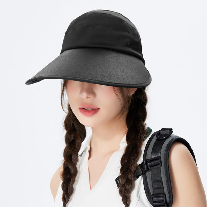 Person wearing a wide-brimmed black hat and carrying a backpack on a white background