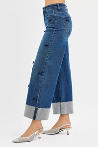Blue jeans with a gray hem on a white background
