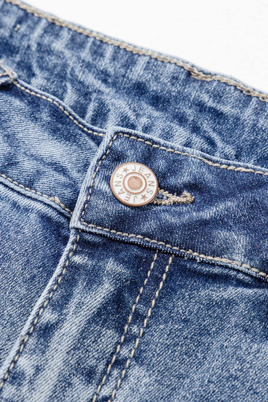 View of button on Distressed Raw Hem Bootcut Jeans