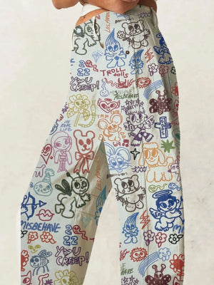Colorful patterned pants with various designs on a plain background