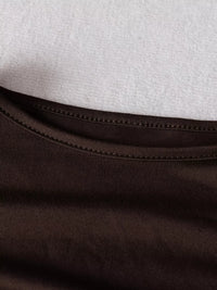 Close-up of brown fabric with a white background
