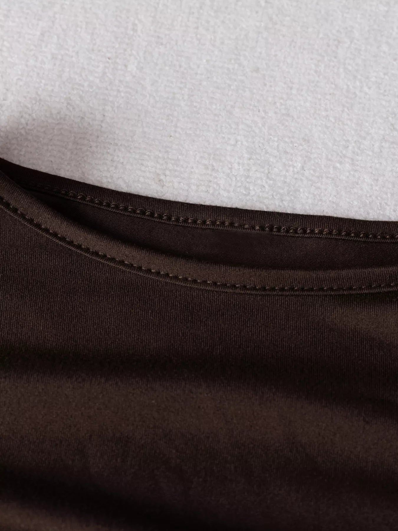 Close-up of brown fabric with a white background