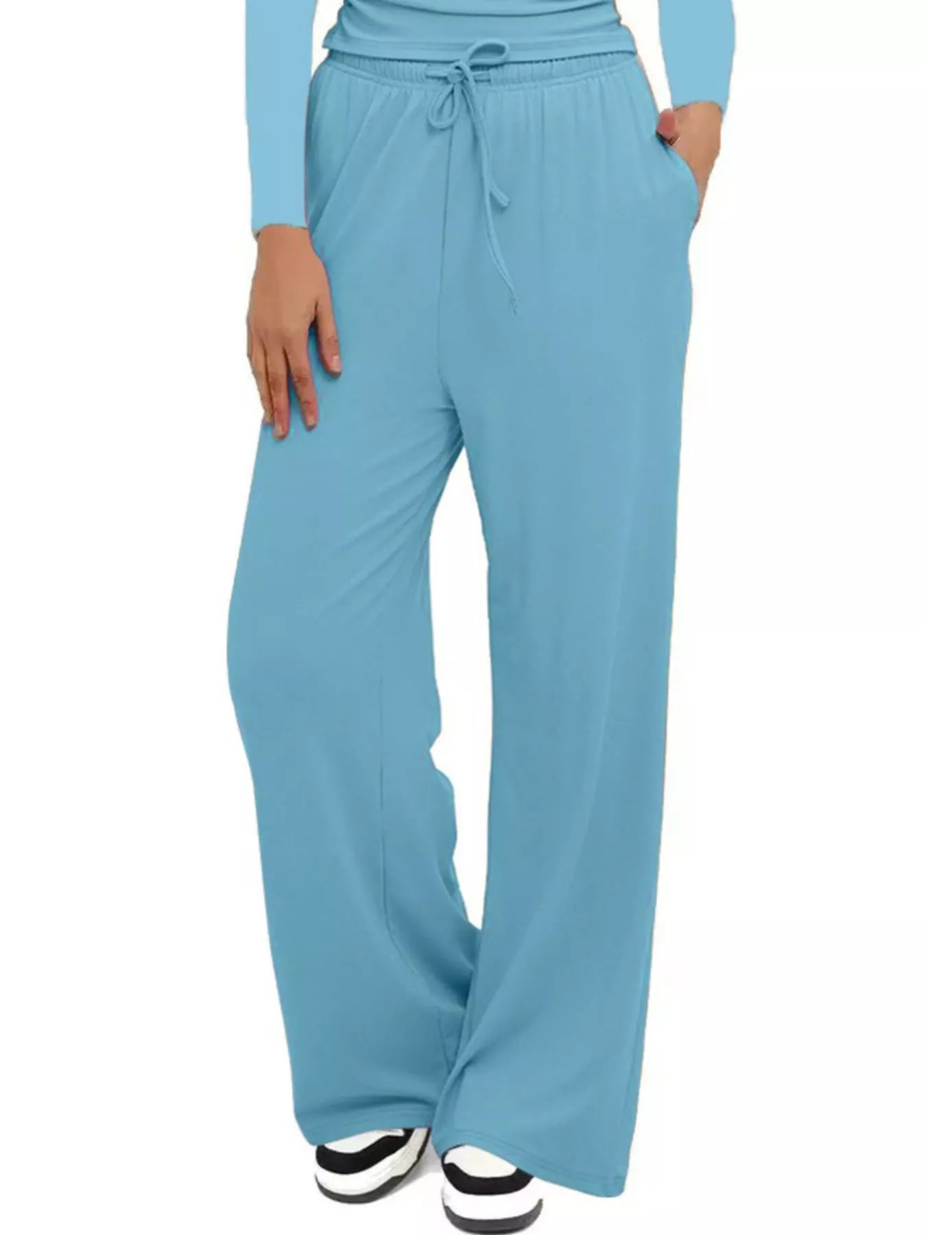 Light blue wide-leg pants worn by a person on a white background