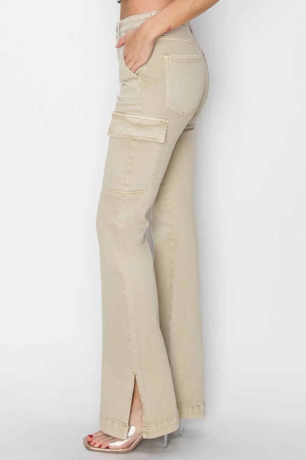 Beige cargo pants worn by a person on a white background
