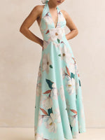 Woman wearing a floral dress with a light blue background