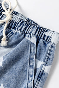 Close-up of denim shorts with a white drawstring on a white background