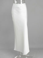 White pencil skirt on a mannequin against a gray background