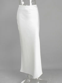 White pencil skirt on a mannequin against a gray background