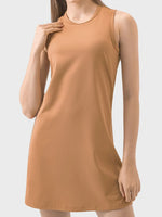 Woman wearing a brown sleeveless dress on a white background