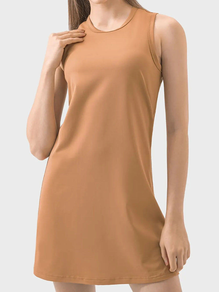 Woman wearing a brown sleeveless dress on a white background