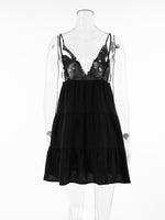 Black lace nightgown on a mannequin against a white background